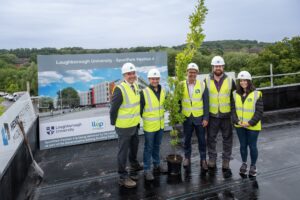 Topping out ceremony takes place for £9m sustainable development being built by Henry Brothers photo